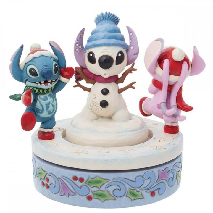 enesco figura decorativa enesco disney stitch y angel con mu?eco de nieve rotativo